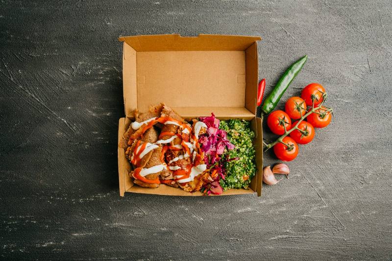 Kebab in a box with salads and sauces